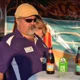 A volunteer serves beer at the Lemoore Lions Brewfest.